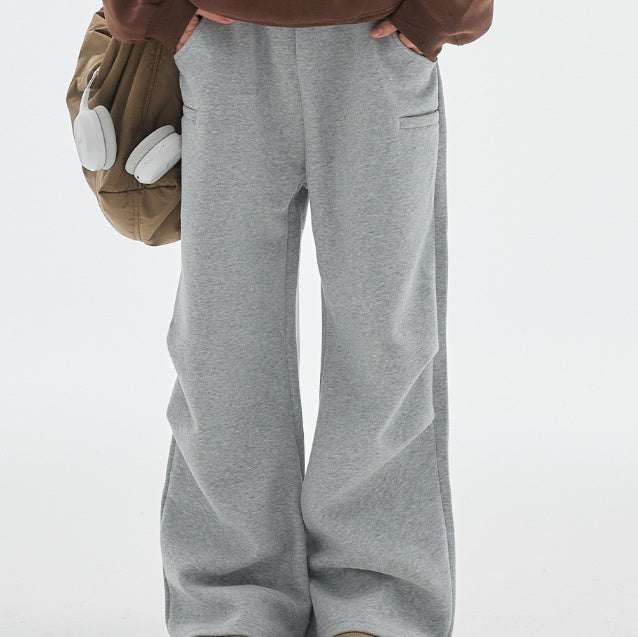 Gray loose fit retro track sweatpants with mid waist and straight leg opening for men
