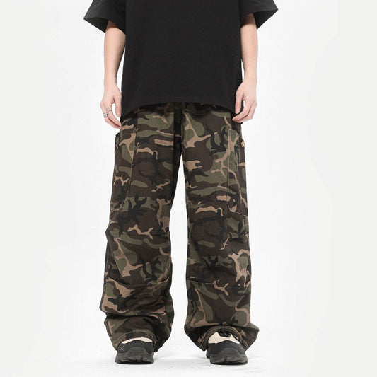 Male model wearing camo straight fit mid-waist cotton camouflage cargo pants in multiple sizes