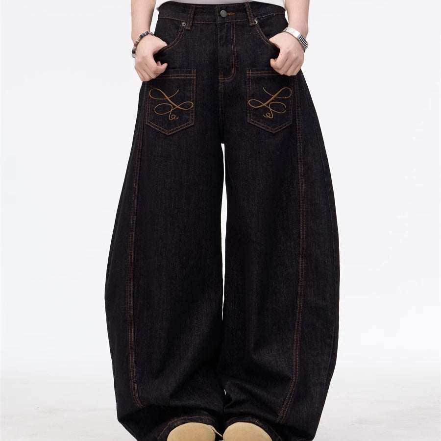 Black wide leg embroidered inside-out jeans with zipper fly and front pockets, available in multiple sizes