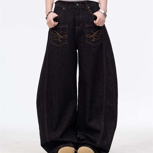 Black wide leg embroidered inside-out jeans with zipper fly and front pockets, available in multiple sizes